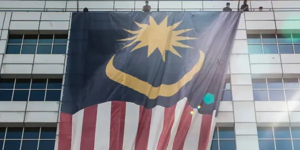 malaysia flag hanging outside a building